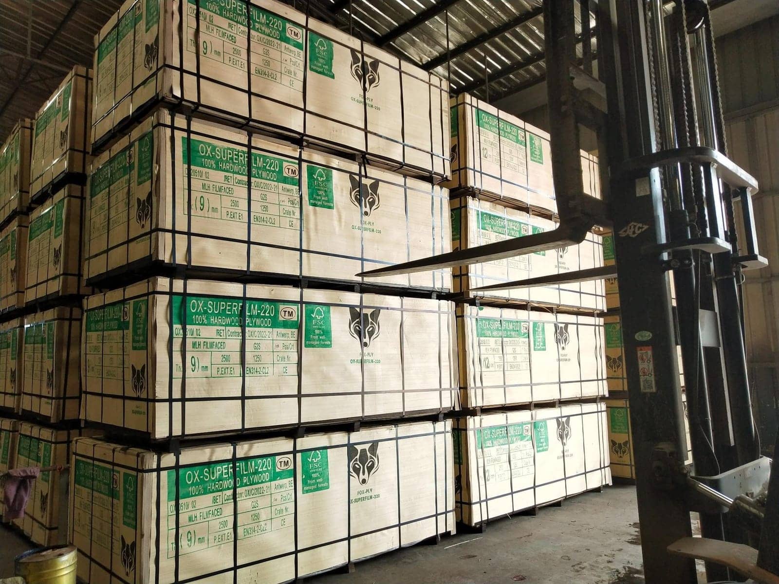 Packs of film-faced plywood in the hold of a breakbulk vessel