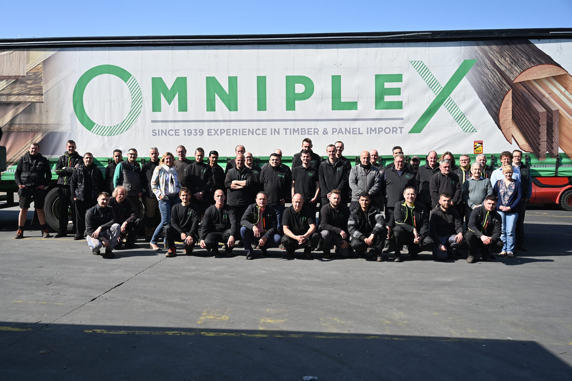 The Omniplex team in front of a truck
